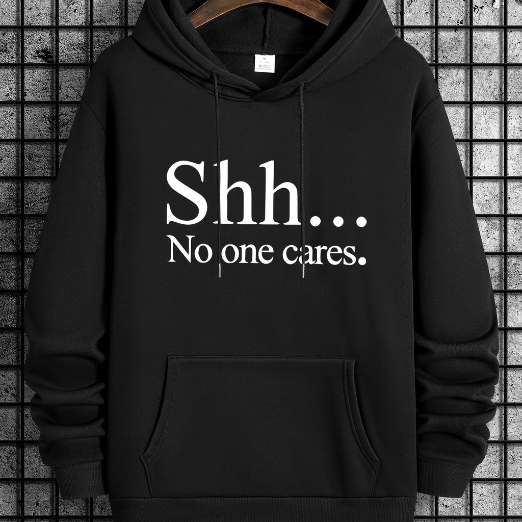 Black pullover hoodie with "Shh... No one cares" text in white letters, featuring front kangaroo pocket and classic design
