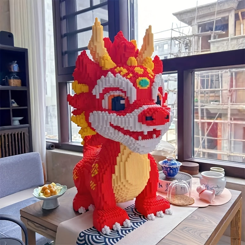 Blaze Guardian dragon building blocks in red and gold displayed on wooden table by window with decorative tea set