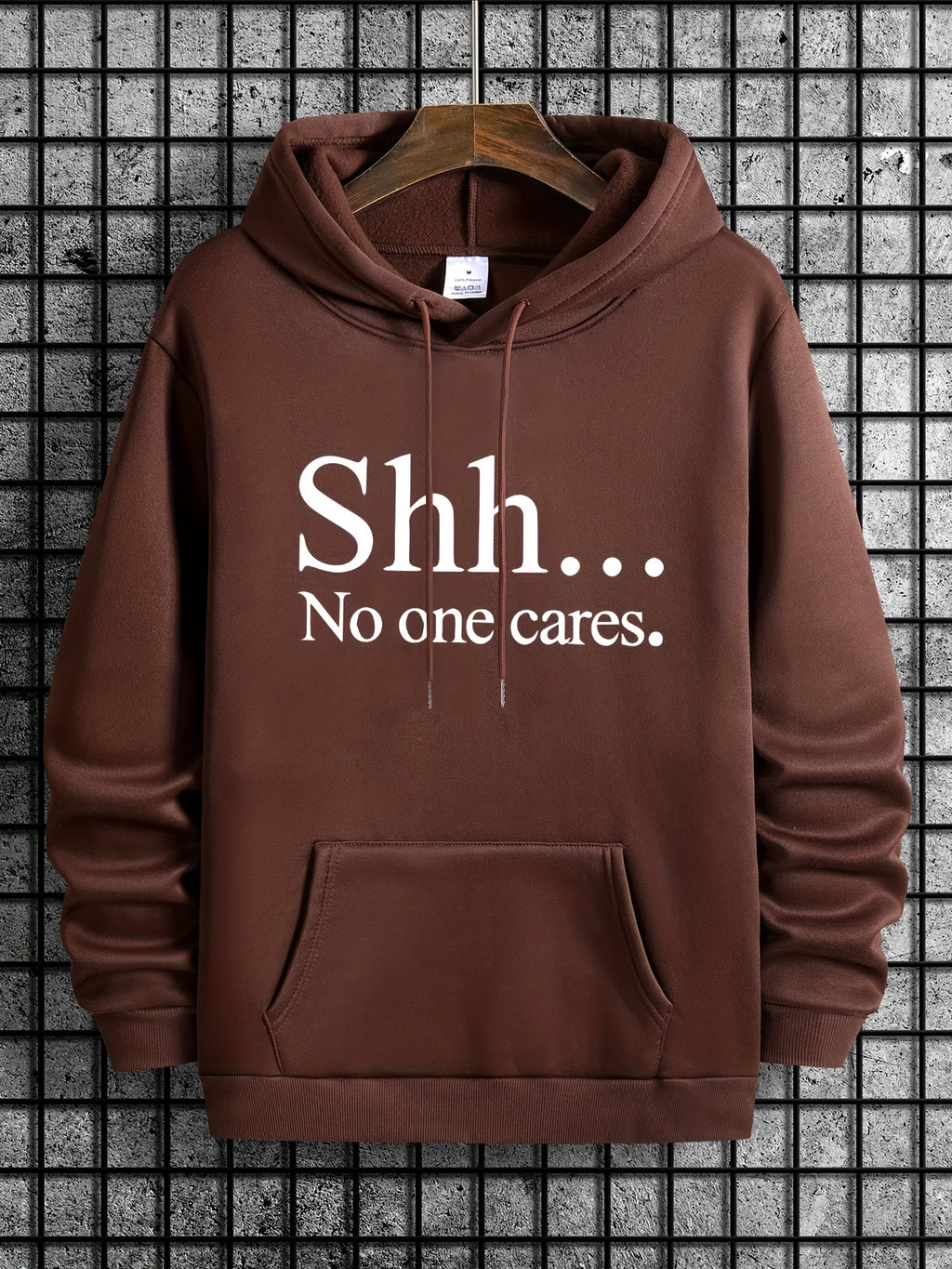 Brown pullover hoodie with "Shh... No one cares" text design - casual streetwear with front kangaroo pocket