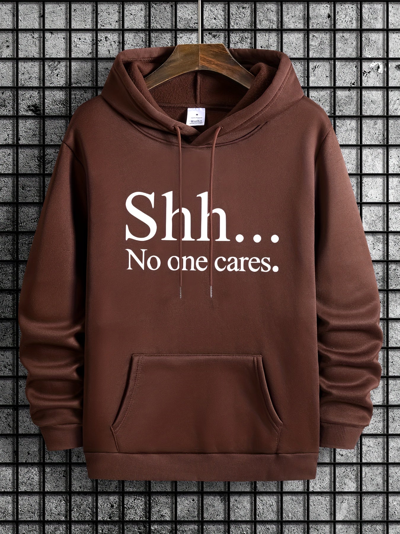 Brown pullover hoodie with "Shh... No one cares" text design - casual streetwear with front kangaroo pocket