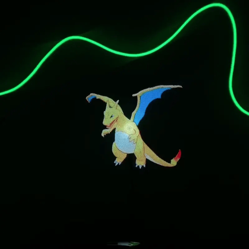 HighPeak AirAura displaying holographic dragon with green neon effect against black background - 3D projection demo
