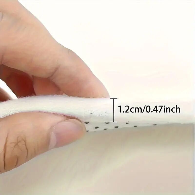 Close-up view of Gravity Vortex 3D Illusion Mat showing 1.2cm thickness with anti-slip perforated base material construction