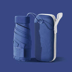 Compact Mini Pocket Umbrella in navy blue with protective travel case showing foldable design and storage solution