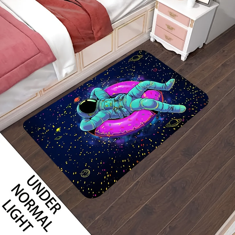 CosmoGlow Astronaut Rug featuring teal spacesuit figure floating on pink donut against starry navy space background