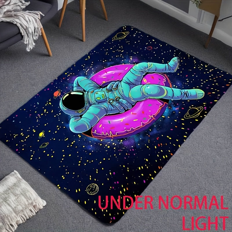 CosmoGlow Astronaut Rug with teal spacesuit floating on pink donut floatie against starry galaxy background, UV-reactive design
