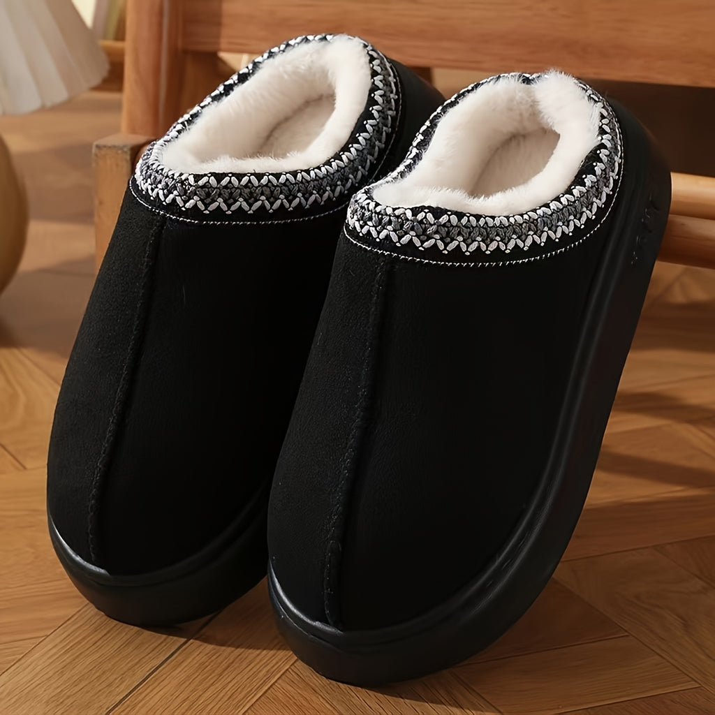 CozyGlide black suede slippers with white fleece lining and nordic trim pattern on wooden floor - cozy indoor footwear