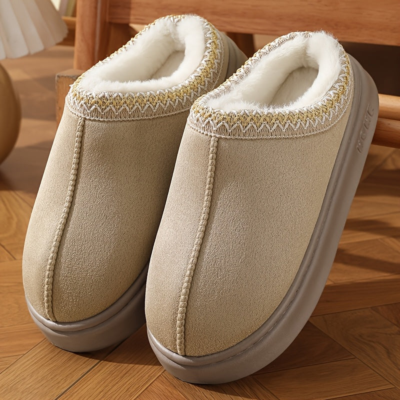 CozyGlide slippers in beige suede with white fleece lining and patterned trim on hardwood floor - cozy indoor comfort