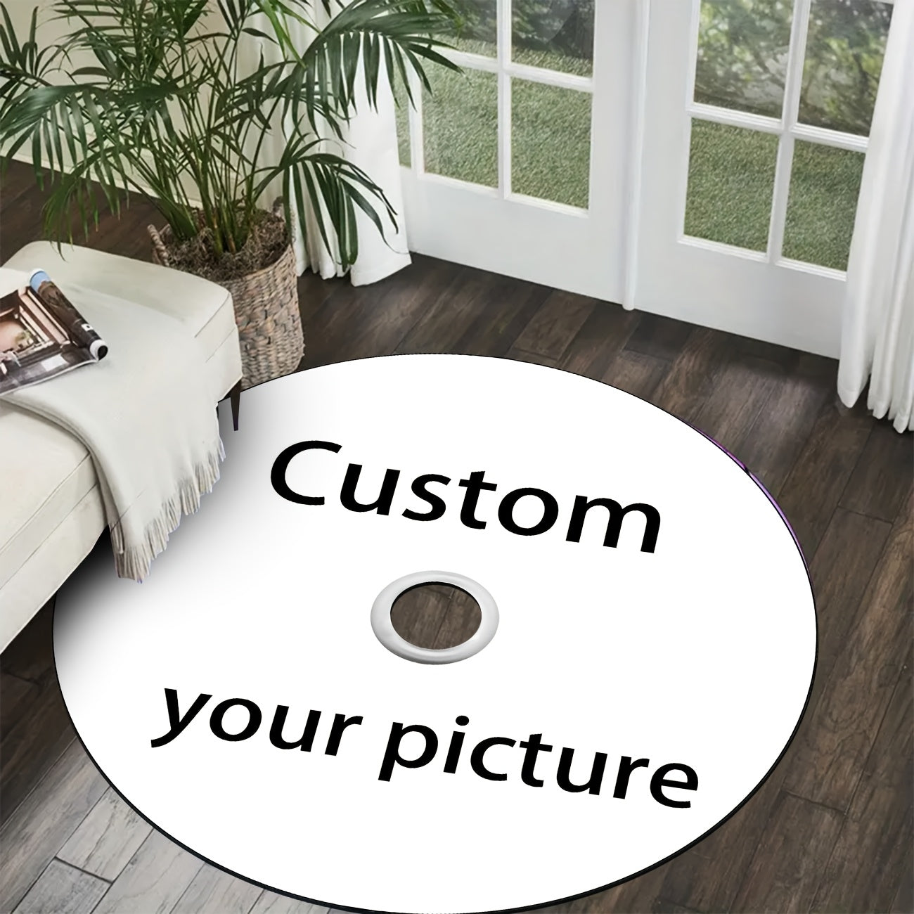 Customizable Disc Carpet displayed as oversized white CD on dark hardwood floor next to white sofa and indoor palm plant
