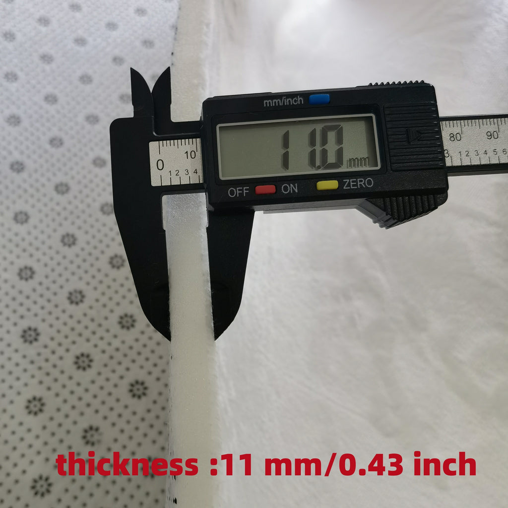Digital caliper measuring Ocean Bliss Mat thickness at 11mm - showcasing comfort layer measurement