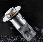 DrainShield drain protector in silver with textured mesh filter and sleek metallic top cap - modern drain guard design