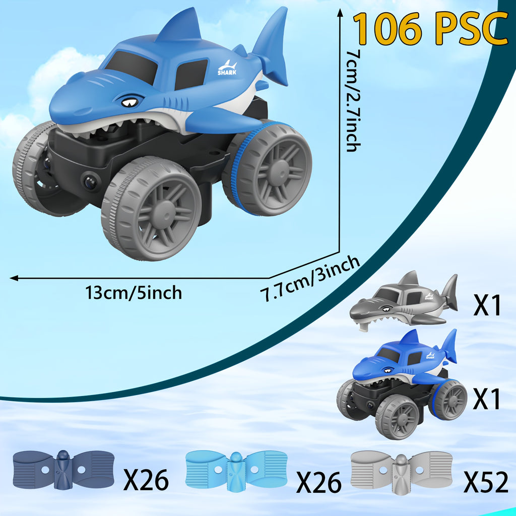 GlowRacer shark-themed toy monster truck in blue with large off-road wheels and detailed fin design against sky background