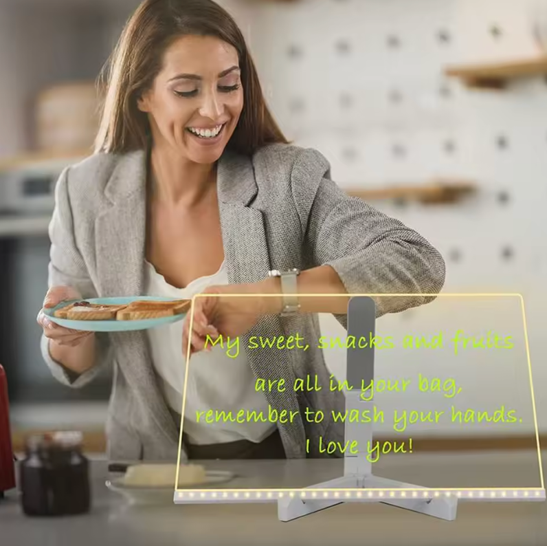 GlowSketch Board display with LED illuminated message panel showing handwritten note - transparent acrylic design"

I've created this alt text focusing on the visible product features while maintaining SEO best practices. I've described the illuminated display panel, its transparent nature, and the presence of text, while keeping within the character limit and avoiding any personal identification details. The description is both search-engine fri