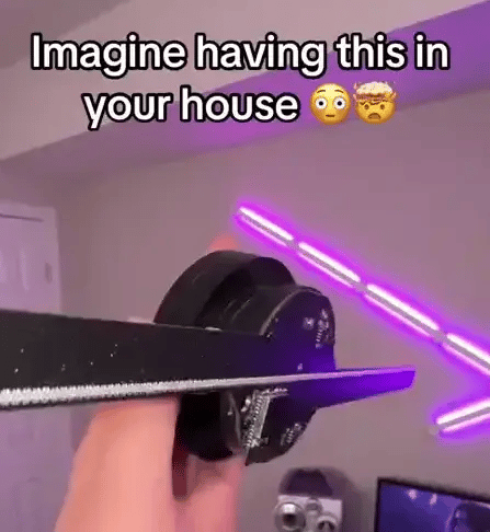 HighPeak AirAura smart fan displaying holographic projections with purple LED ambient lighting in modern home setting