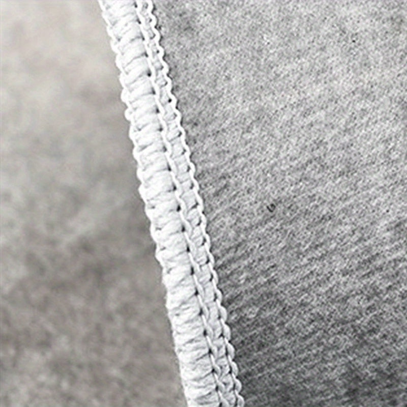 HighPeak Black Basketball Court Rug featuring close-up of white decorative braided edge trim on durable gray fabric backing