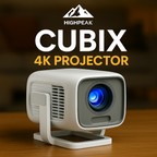 HighPeak CUBIX 4K projector in white compact cube design with blue lens on wooden surface