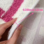 HighPeak ChillPill bath rug in pink and white plush design with non-slip backing, showing thick 0.59-inch soft texture