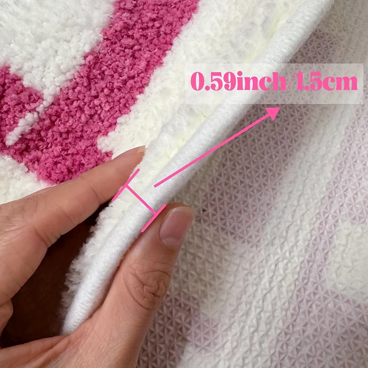 HighPeak ChillPill bath rug in pink and white plush design with non-slip backing, showing thick 0.59-inch soft texture