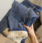 HighPeak ComfiJeans blue denim jeans with cozy fleece lining, shown folded to display warm interior and classic wash