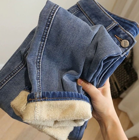 HighPeak ComfiJeans blue denim jeans with cozy fleece lining, shown folded to display warm interior and classic wash
