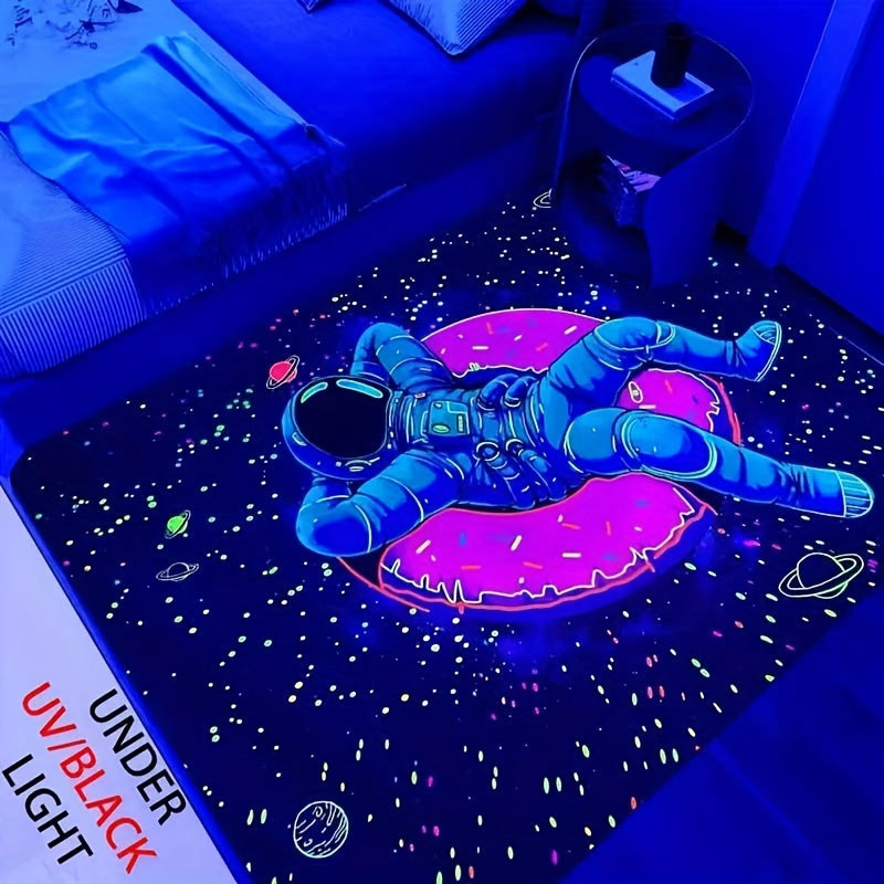 HighPeak CosmoGlow Astronaut Rug with glowing space design in blue and pink, floating astronaut on starry background under UV light