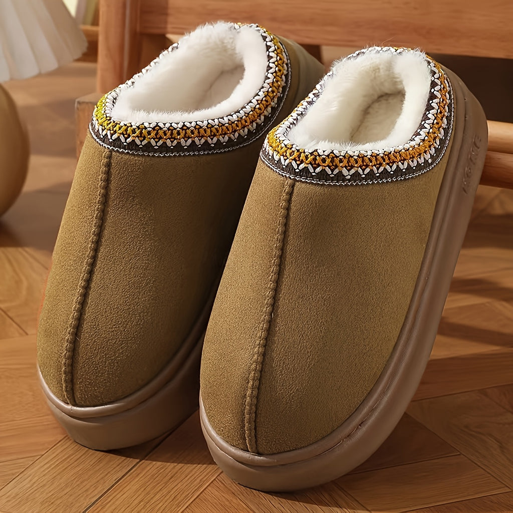 HighPeak CozyGlide slippers in tan suede with white fleece lining and decorative tribal trim on wooden floor