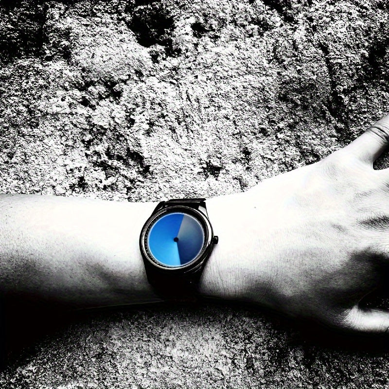 HighPeak EclipseMotion watch with black mesh band and blue gradient dial worn on wrist against textured background
