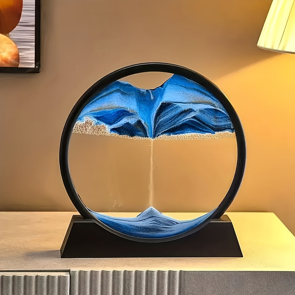 HighPeak Eclipse Flow dynamic sand art display with blue sand creating mountain shapes in circular black frame on wooden surface