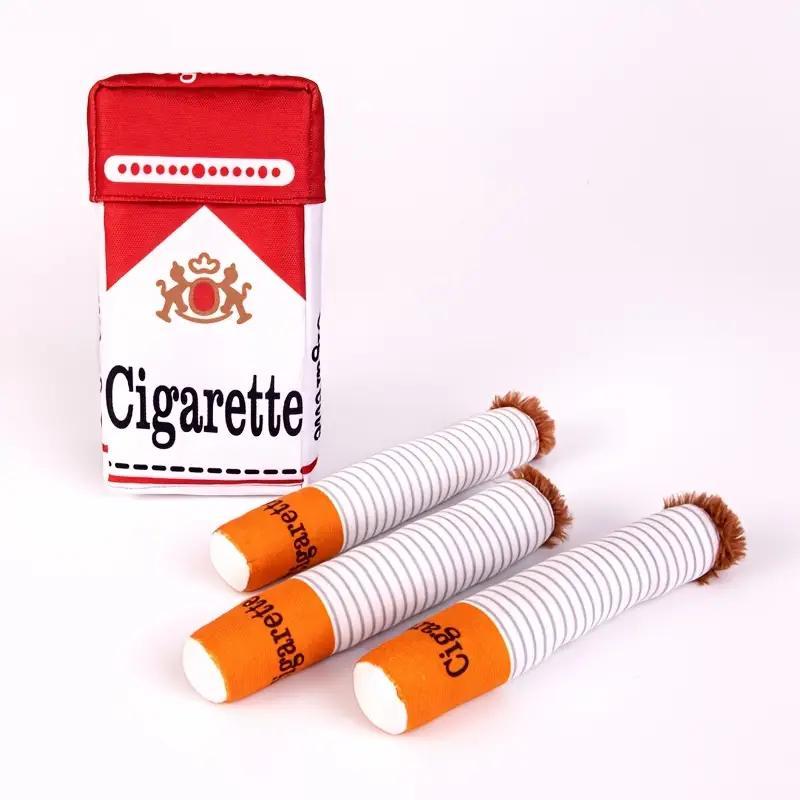 HighPeak HoundSmokes plush toy set featuring red cigarette pack with three white plush cigarettes with orange tips