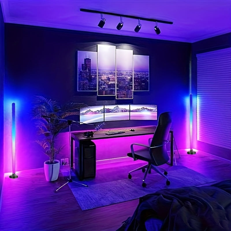 HighPeak LumePillar RGB Sync floor lamps illuminating modern gaming setup with purple and blue ambiance in dark room