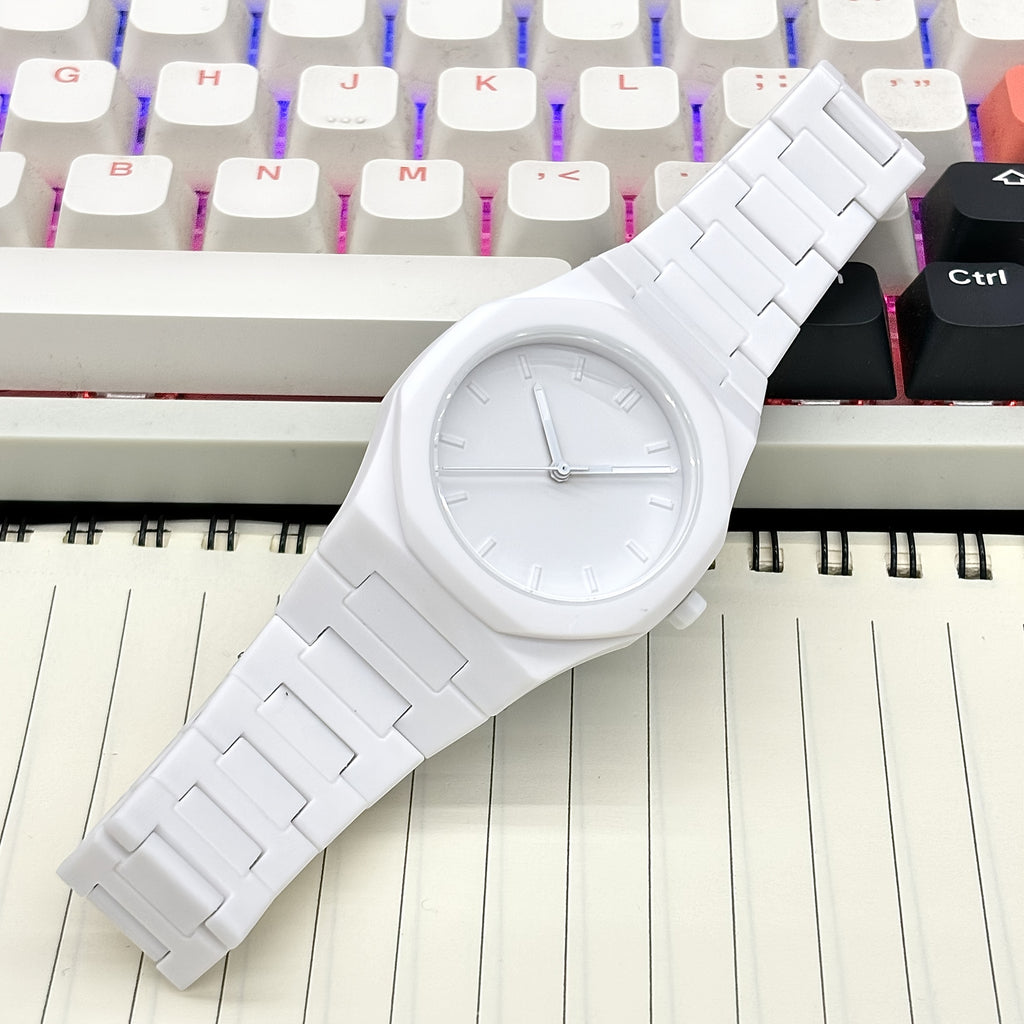 HighPeak Midnight Phantom watch in pure white ceramic on keyboard - minimalist luxury timepiece with monochrome design