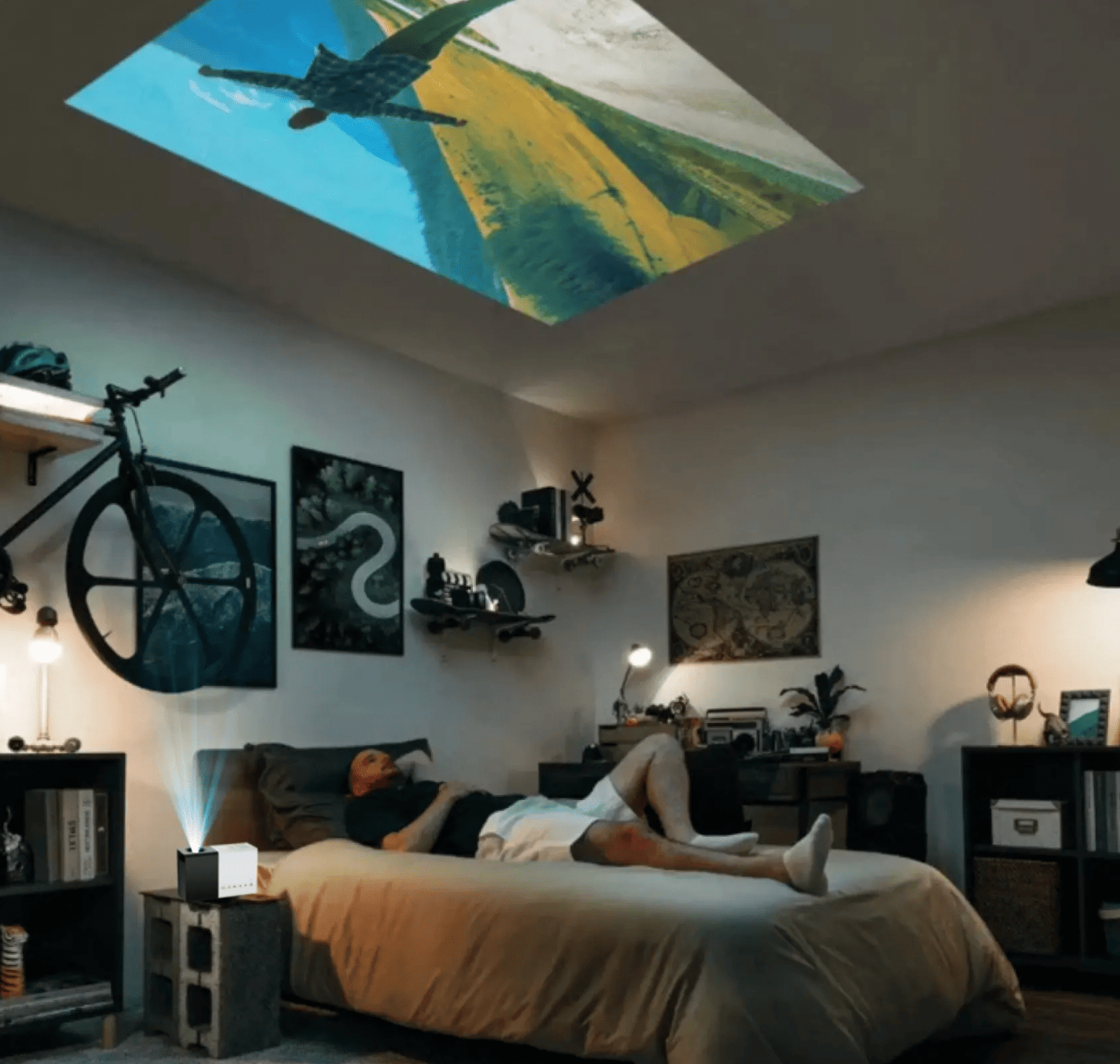 HighPeak MiniProjector displaying plane scene on bedroom ceiling with modern decor and ambient lighting
