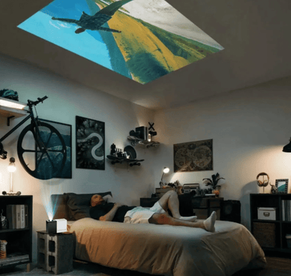 HighPeak MiniProjector displaying plane scene on bedroom ceiling with modern decor and ambient lighting
