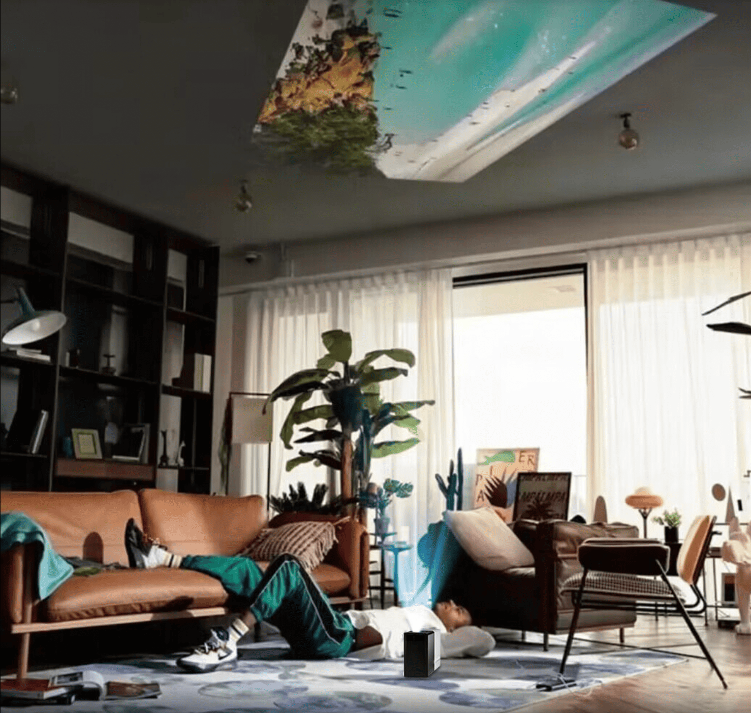 HighPeak MiniProjector projecting beach scene on ceiling in modern living room with tan leather couch and indoor plants