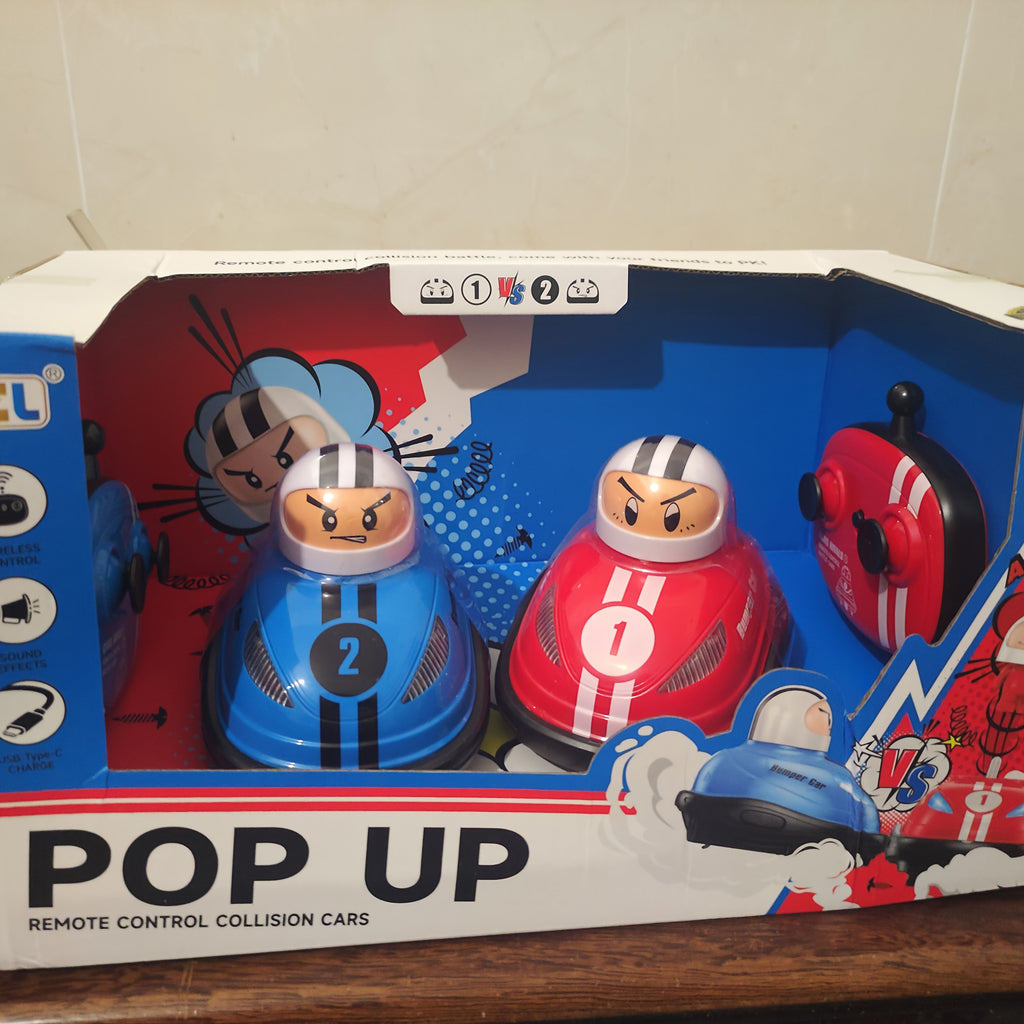 HighPeak Pop Up RC Bumper Cars set featuring red and blue collision cars with ejectable drivers in retail packaging