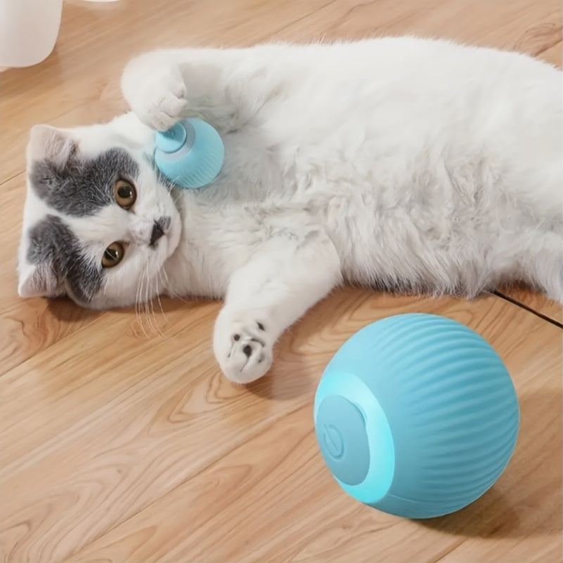 HighPeak PounceBall smart cat toy in turquoise shown with cat on wooden floor - interactive pet play ball