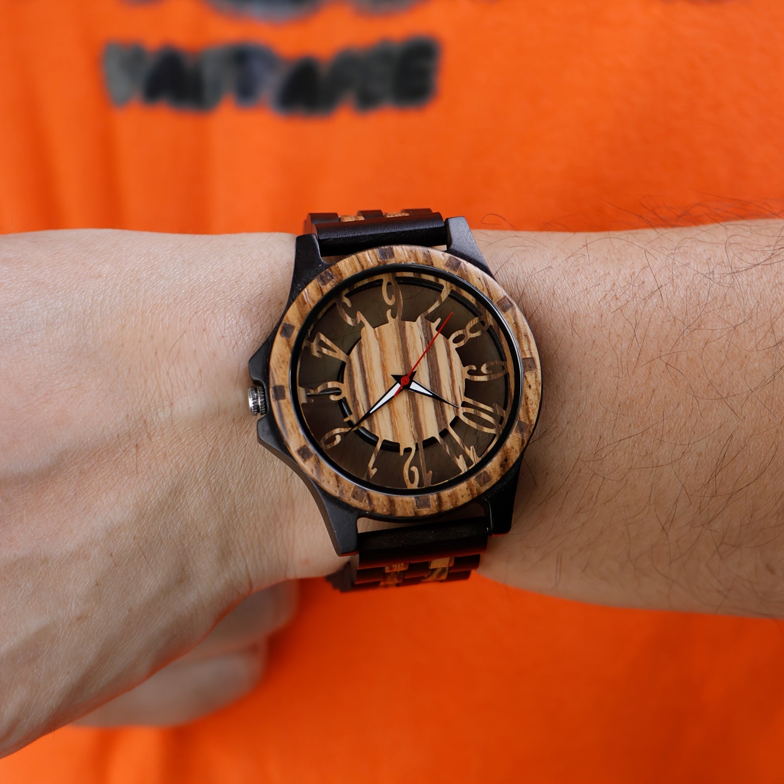 HighPeak RusticEdge wooden timepiece with hollow carved dial and two-tone wood band, displayed on wrist against orange background