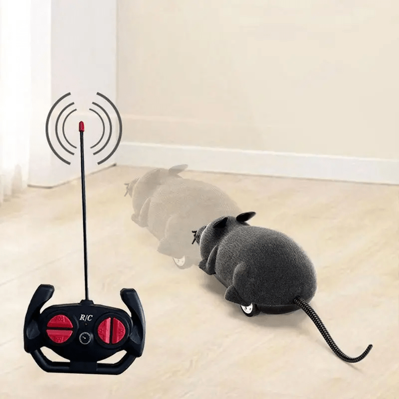 HighPeak ScamperBot remote-control grey mouse toy with black controller on hardwood floor - interactive pet play toy