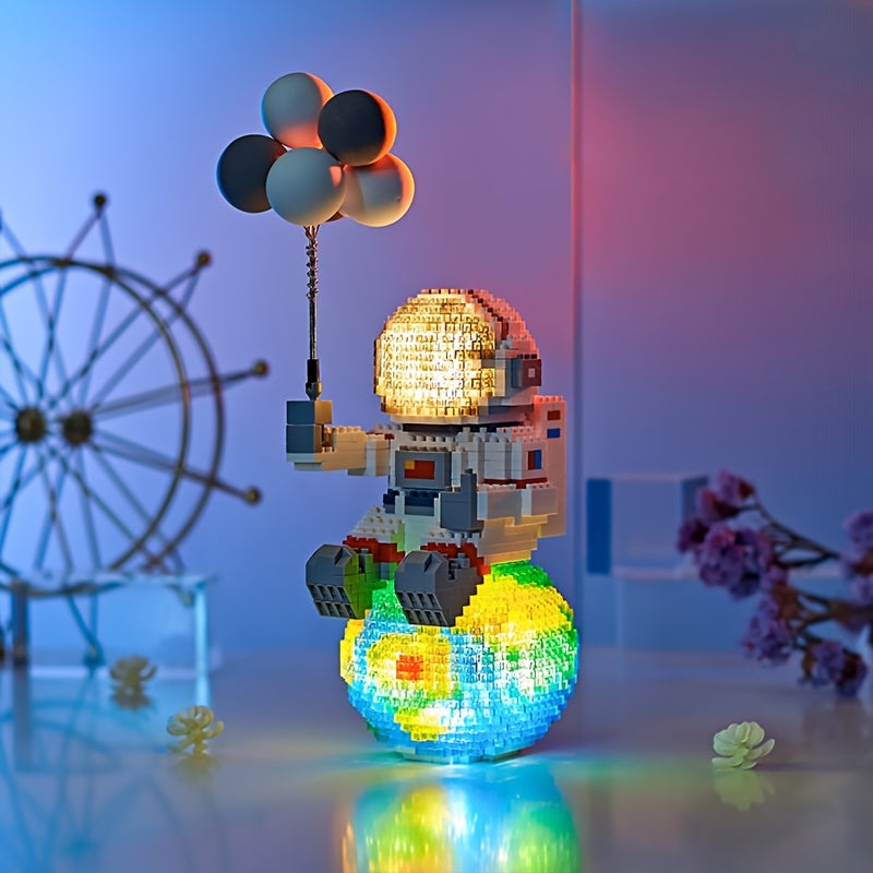 HighPeak Starlight Voyager astronaut building set with illuminated globe base and balloon display under atmospheric lighting
