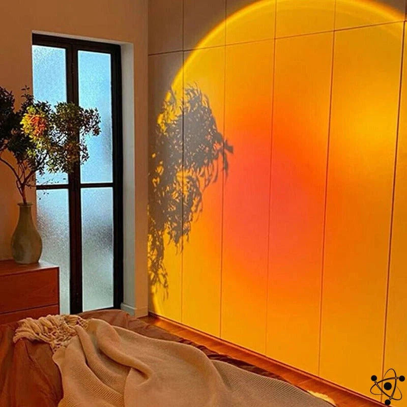 HighPeak Sunset Lamp projecting vibrant orange glow on white wall with plant shadow silhouette in modern bedroom setting