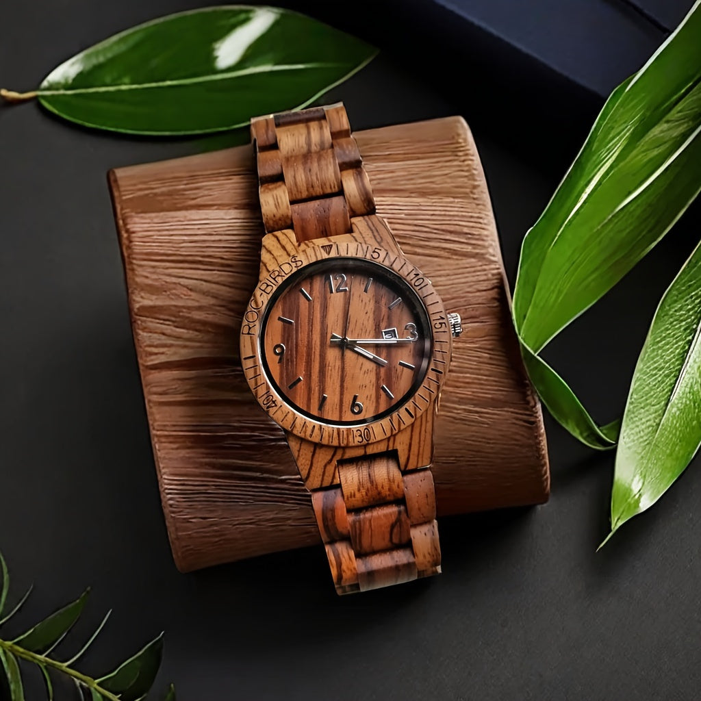 HighPeak TimberTime zebra wood watch with calendar display on wooden stand, surrounded by green leaves on black surface