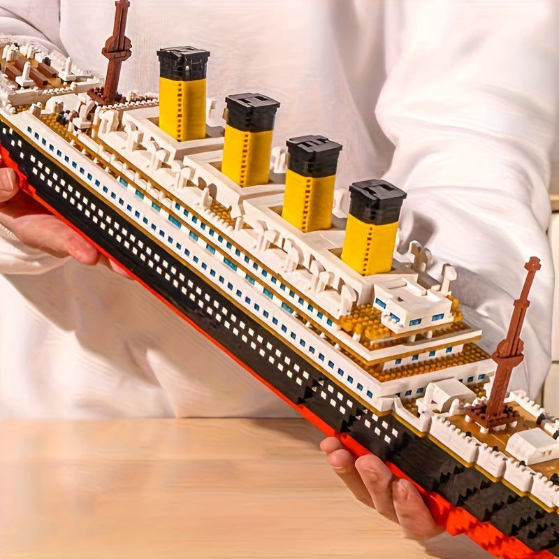 HighPeak Titanic Building Block Set displayed at angle showing detailed yellow smokestacks, white decks and intricate ship design