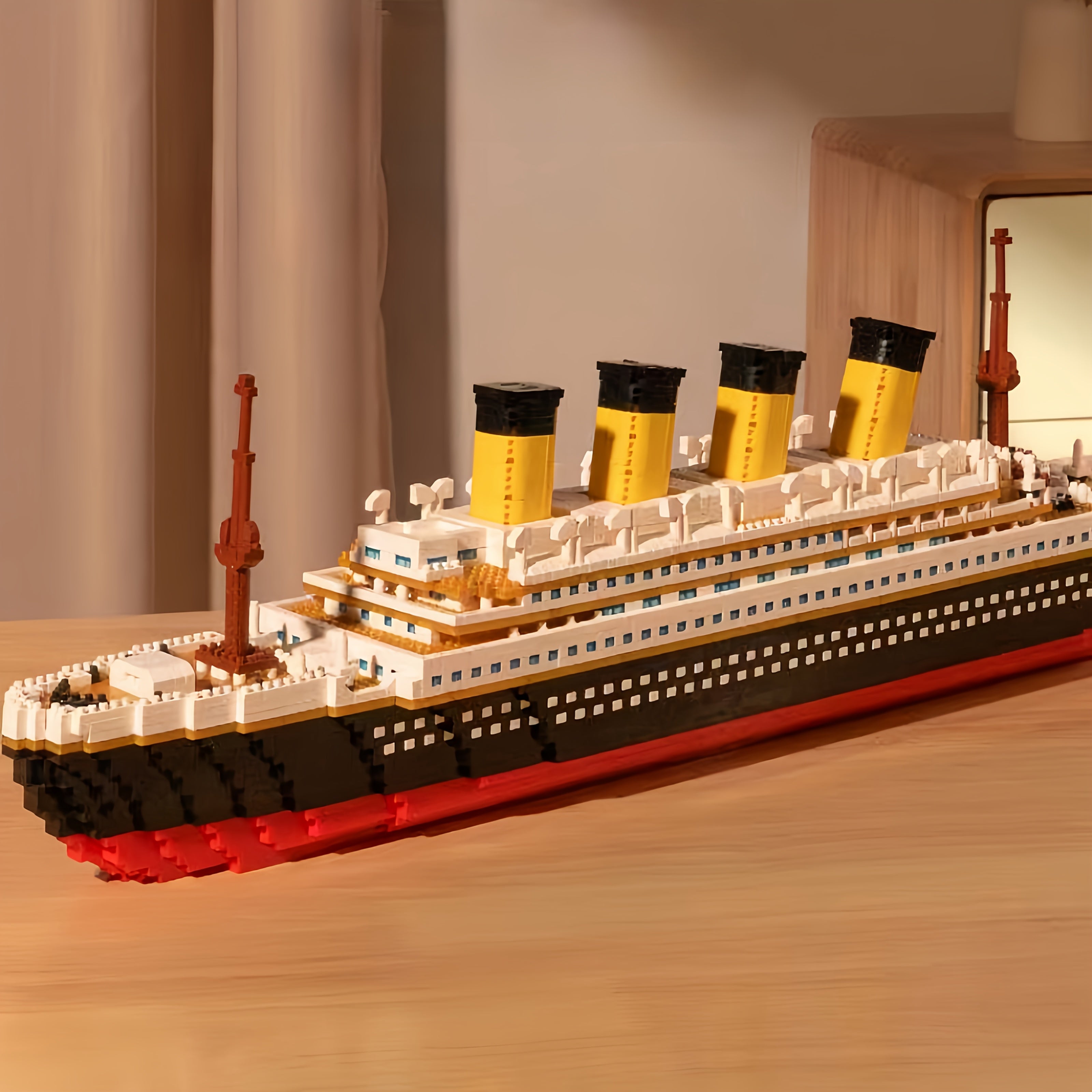 HighPeak Titanic Building Block Set displaying detailed model ship with yellow smokestacks and classic black-white-red hull design