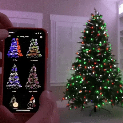 HolidayGlow Lights app control demonstration showing color-changing LED patterns on Christmas tree with smartphone interface