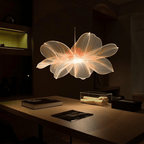 HoloFrame AirAura displaying translucent flower hologram in warm orange glow over modern desk - 3D projection in dark room