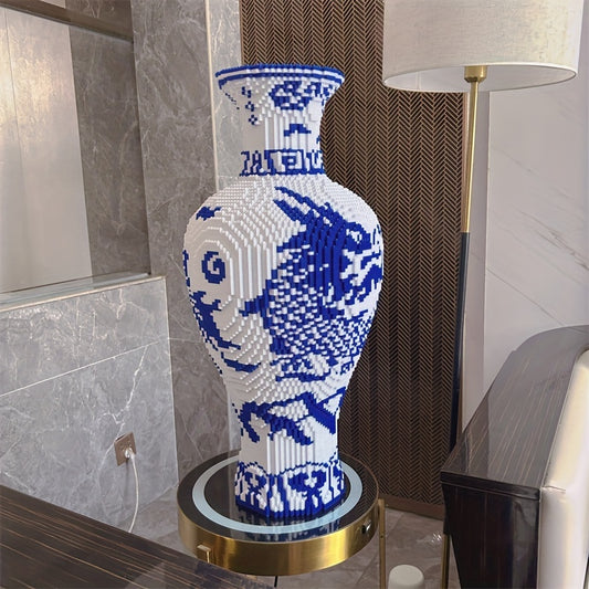 LegacyVase in blue and white porcelain pattern, displayed on gold-rimmed pedestal with classic Chinese fish design