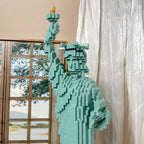 LibertyBrick Masterpiece turquoise 3D brick model of Statue of Liberty displayed near window with natural lighting