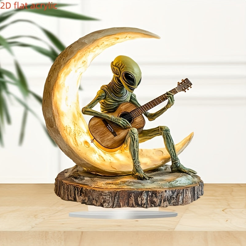 Lunar Strummer alien figure playing acoustic guitar on illuminated crescent moon - cosmic resin sculpture on wood base