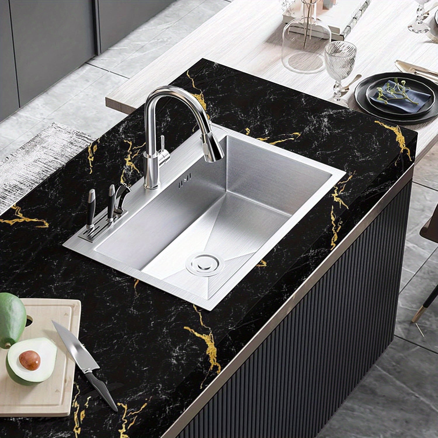 LuxeMarble™ black and gold marble vinyl wrap showcased on modern kitchen countertop with stainless steel sink and faucet