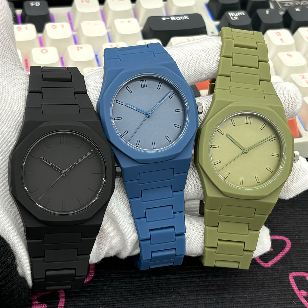 Midnight Phantom stealth watches in matte black, blue, and olive green with minimalist dials and metal link bands