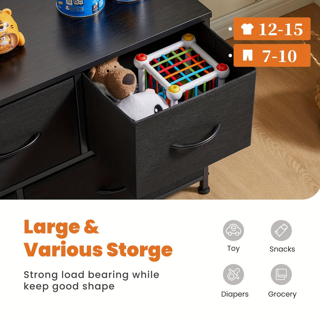 Modern black TV stand and dresser with open drawer displaying storage capacity for toys and media